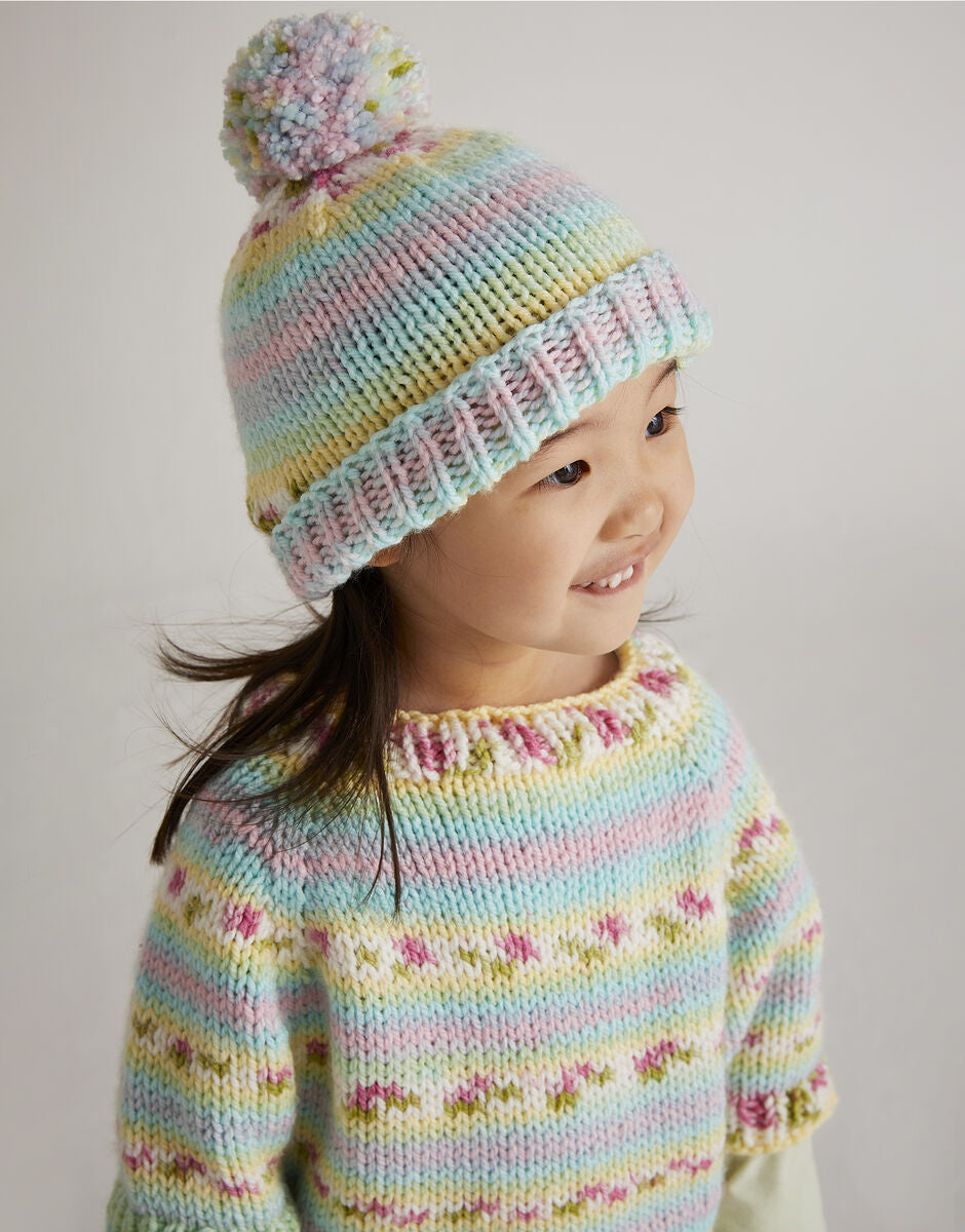 Knitting Pattern 5570 - NEW BLOOMS PONCHO AND HAT IN HAYFIELD BABY BLOSSOM CHUNKY