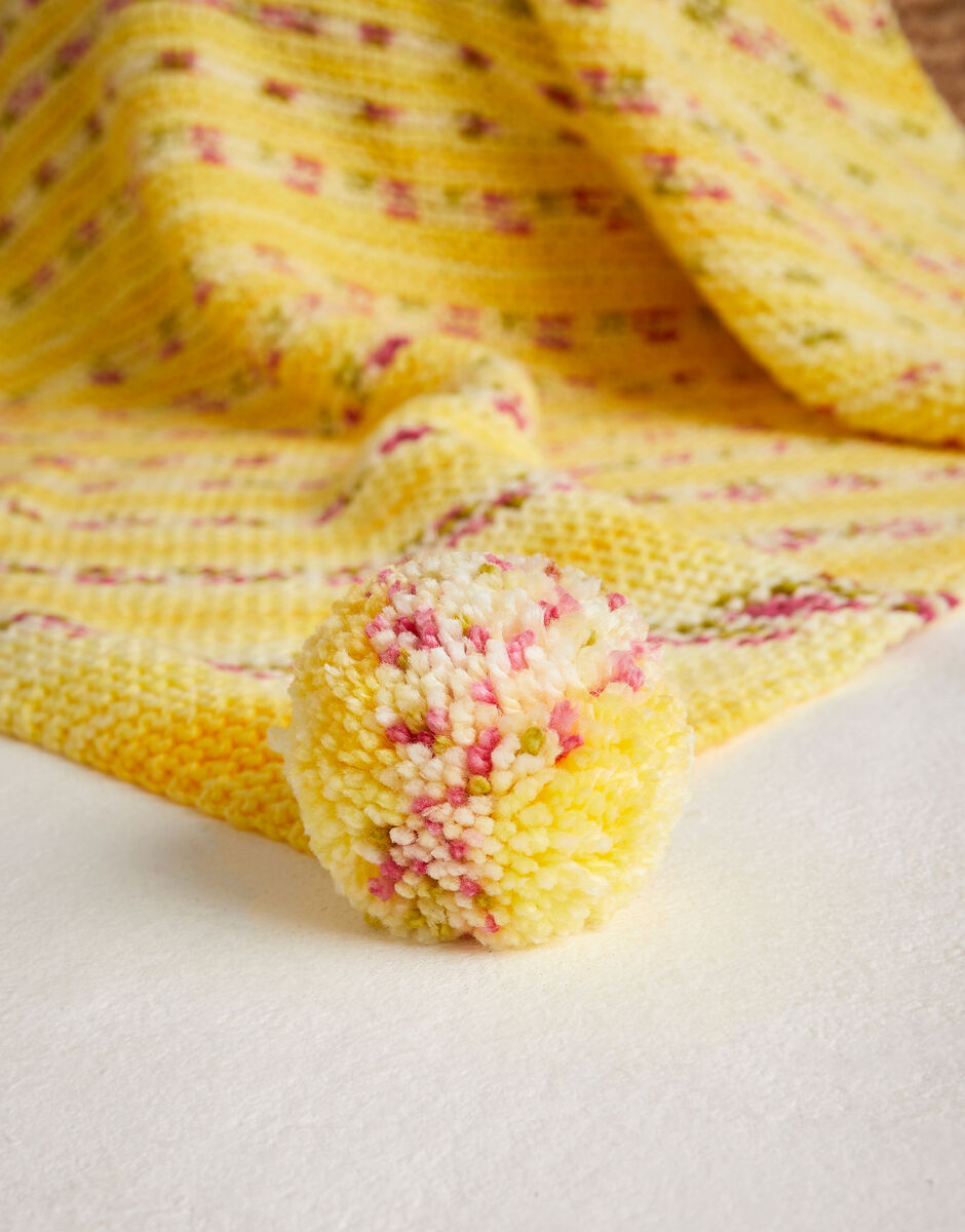 Knitting Pattern 5575 - PETAL POM POM BLANKET IN HAYFIELD BABY BLOSSOM CHUNKY
