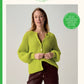 Sirdar Loveful knitting pattern cover featuring a woman wearing a chunky knit lime green cardigan. The cover has a cream background with green text and borders, including the Sirdar brand name, design number 10971, and product details for the bio blend yarn.