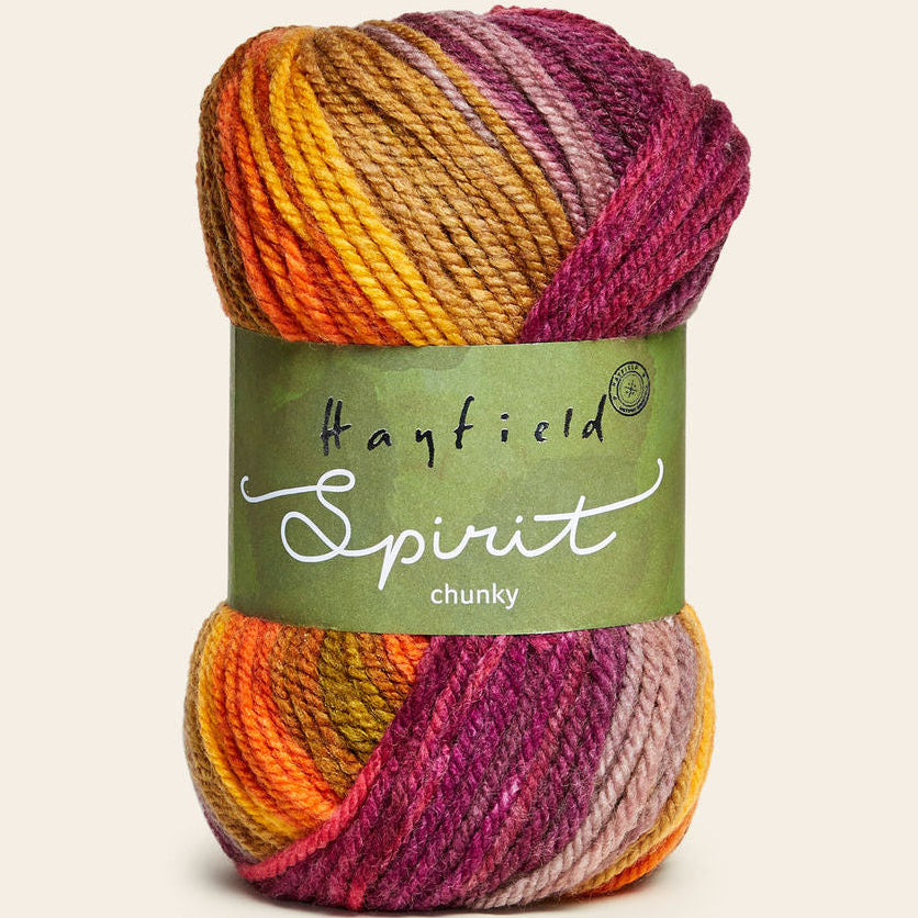 Multicolored skein of yarn with 'Hayfield Spirit' label on a beige background