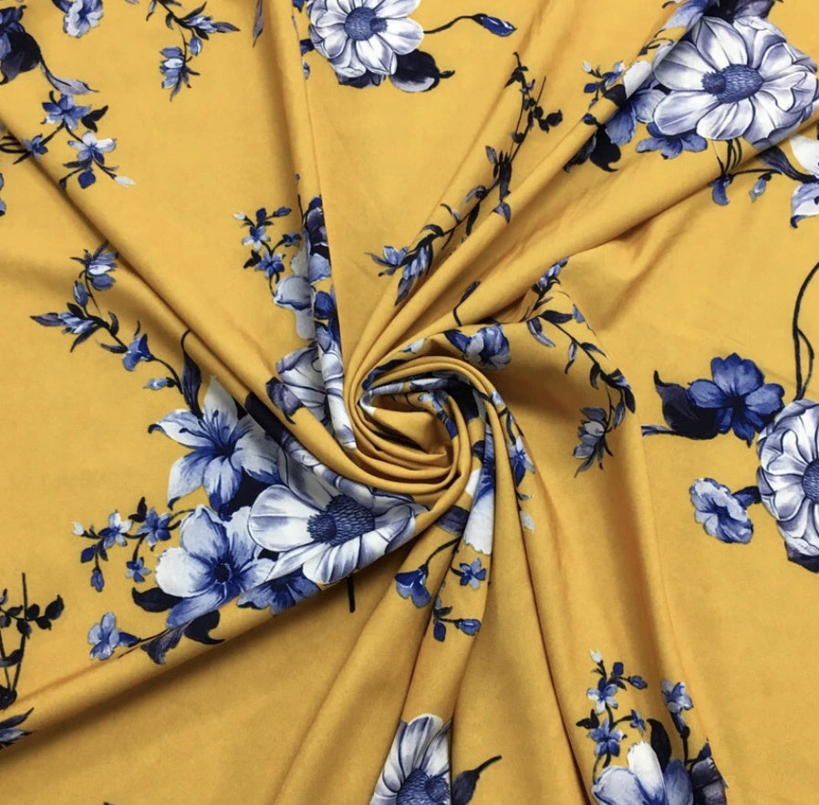 BLUE FLOWERS ON MUSTARD STRETCH POLYESTER